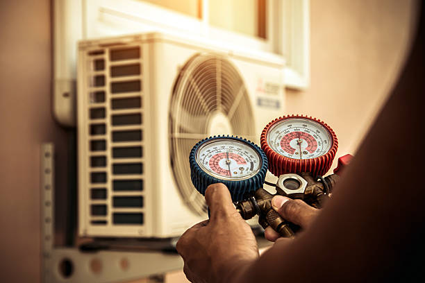 Professional Air Conditioning Service technician working in Melrose, NY